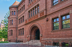 This is Harvard's Sever Hall, where students take classes such as French 30. It faces Tercentary Theater, which is the main part of The Yard. When our couriers go to distribute at Canaday Hall, they often walk by Sever hall.